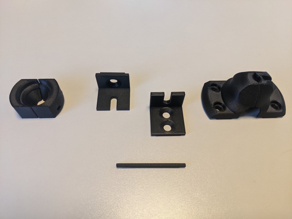 Selection of replaced 3D printed jaws, fingers and brackets on Markforged, printed in non-marring Onyx 