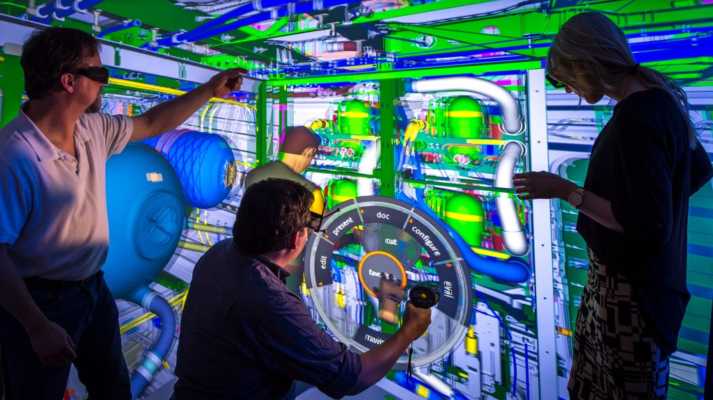 From left, manufacturing engineer Josh Little, Boeing Research & Technology’s Adam Richardson and production engineer Meagan Haugo follow the movements of a virtual mannequin