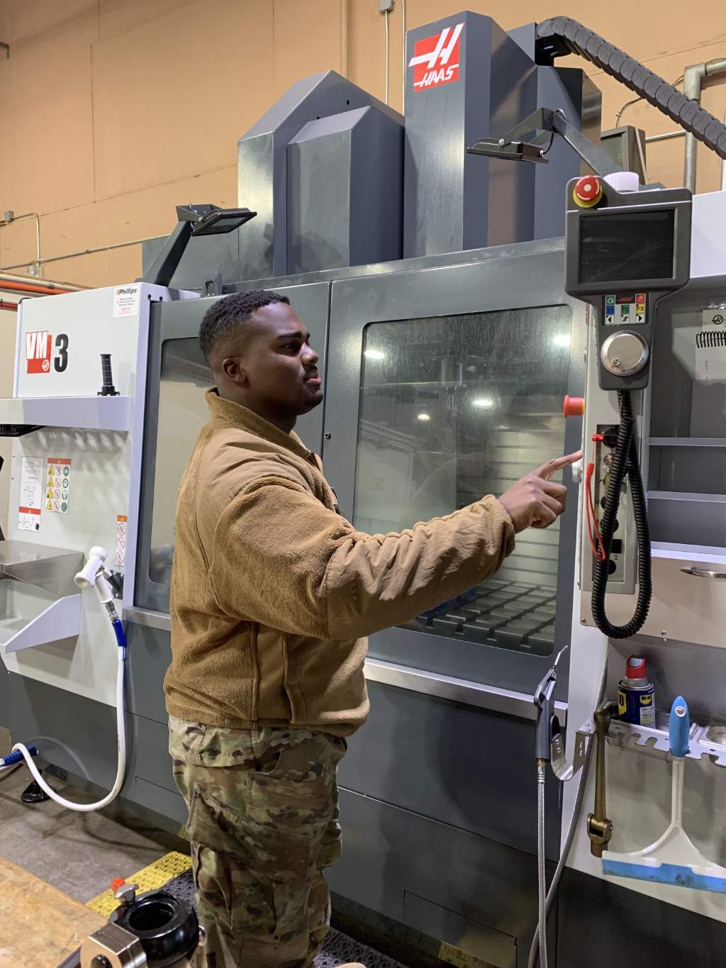 Staff Sgt. Kevin Davis, a machinist with the Air Force Research Laboratory’s Aerospace Systems Directorate, operates one of AFRL’s new milling machines in the rocket fabrication shop at Edwards Air Force Base, California